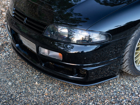 Side angle showcasing clean lines of the R33 M-Spec front lip