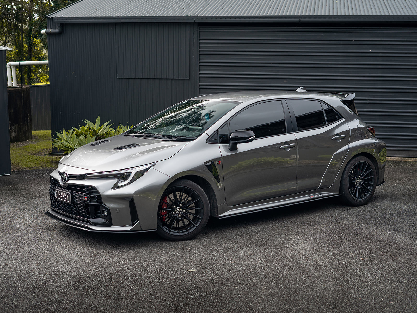 Low front shot of GR Corolla complete lip kit for aggressive styling.