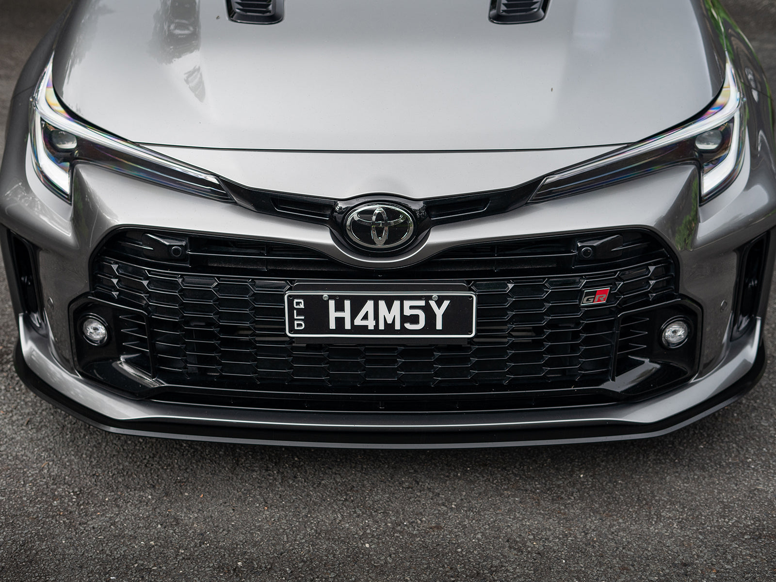 Close-up of GR Corolla’s bumper lines blended with the front lip attachment.
