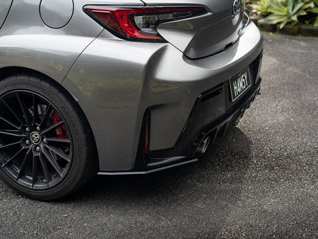 Ground-level shot of GR Corolla rear pods highlighting fitment and depth.