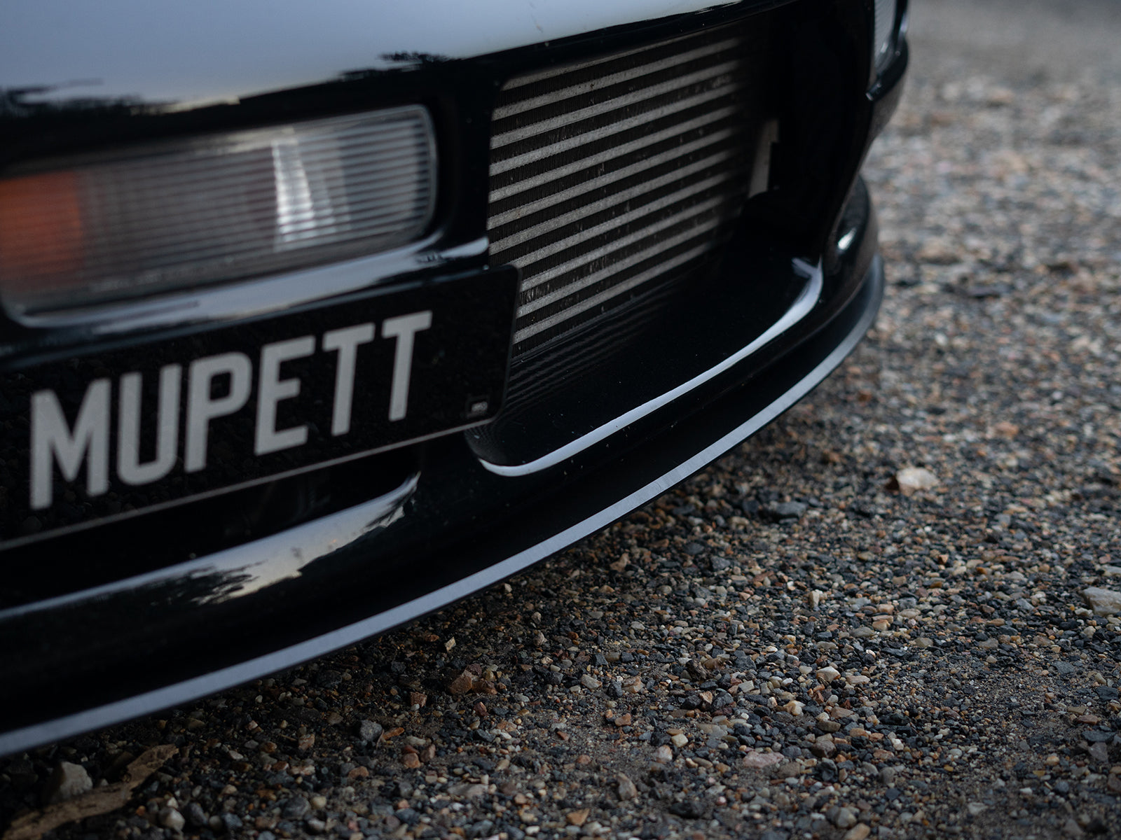 Detailed view of front lip styling on R33 M-Spec Skyline bumper

