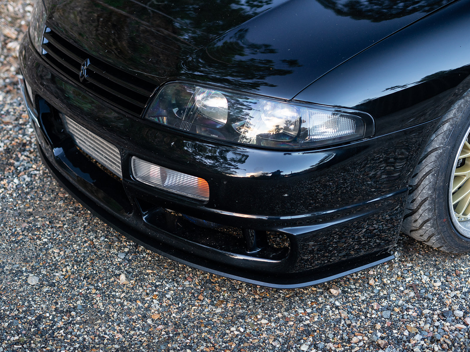 Side angle showcasing clean lines of the R33 M-Spec front lip
