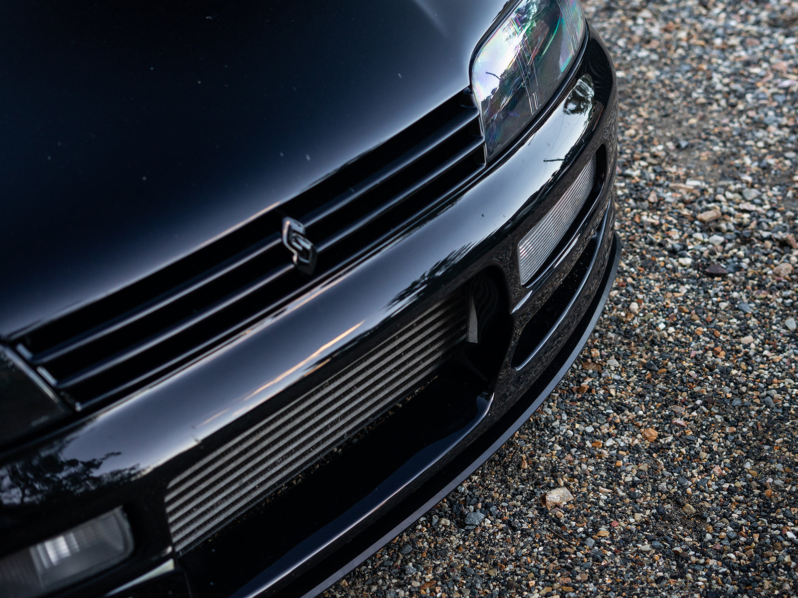 Close-up of R33 M-Spec front lip with seamless fitment
