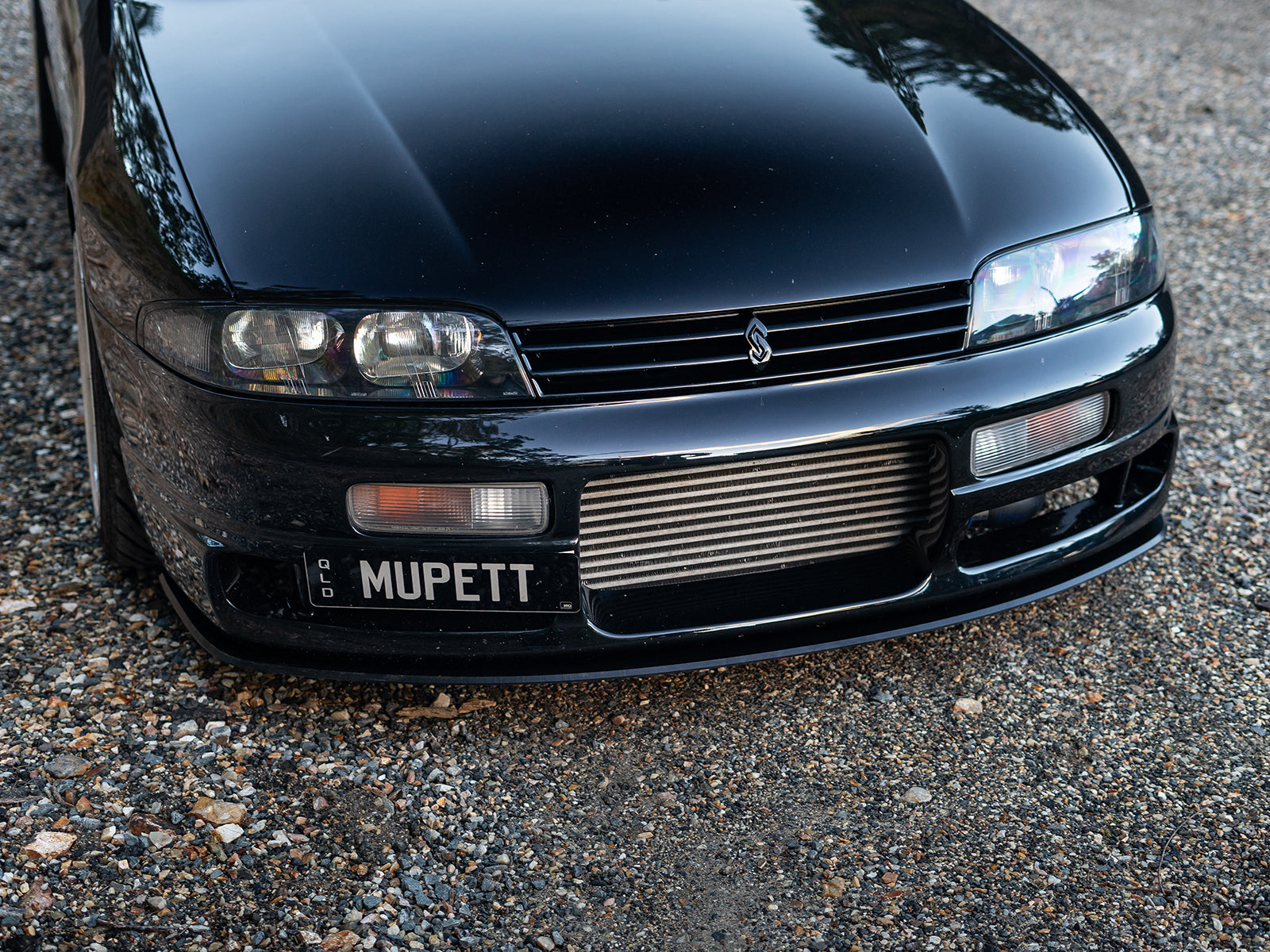 Nissan R33 Skyline featuring Project Aero’s M-Spec front lip in black
