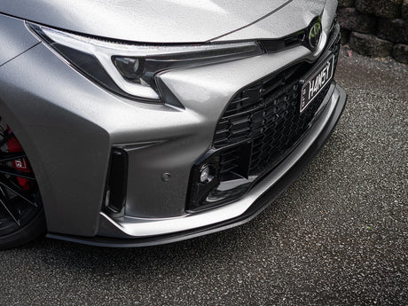 Front view of GR Corolla with custom aero front lip fitted, showcasing aggressive styling.
