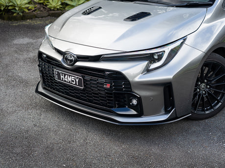 Front view of GR Corolla with custom aero front lip fitted, showcasing aggressive styling.
