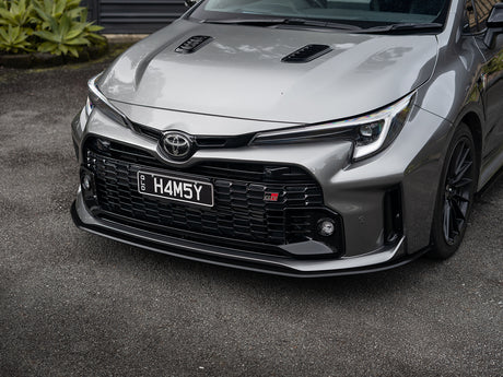 GR Corolla parked with new front lip installed, adding motorsport-inspired presence.
