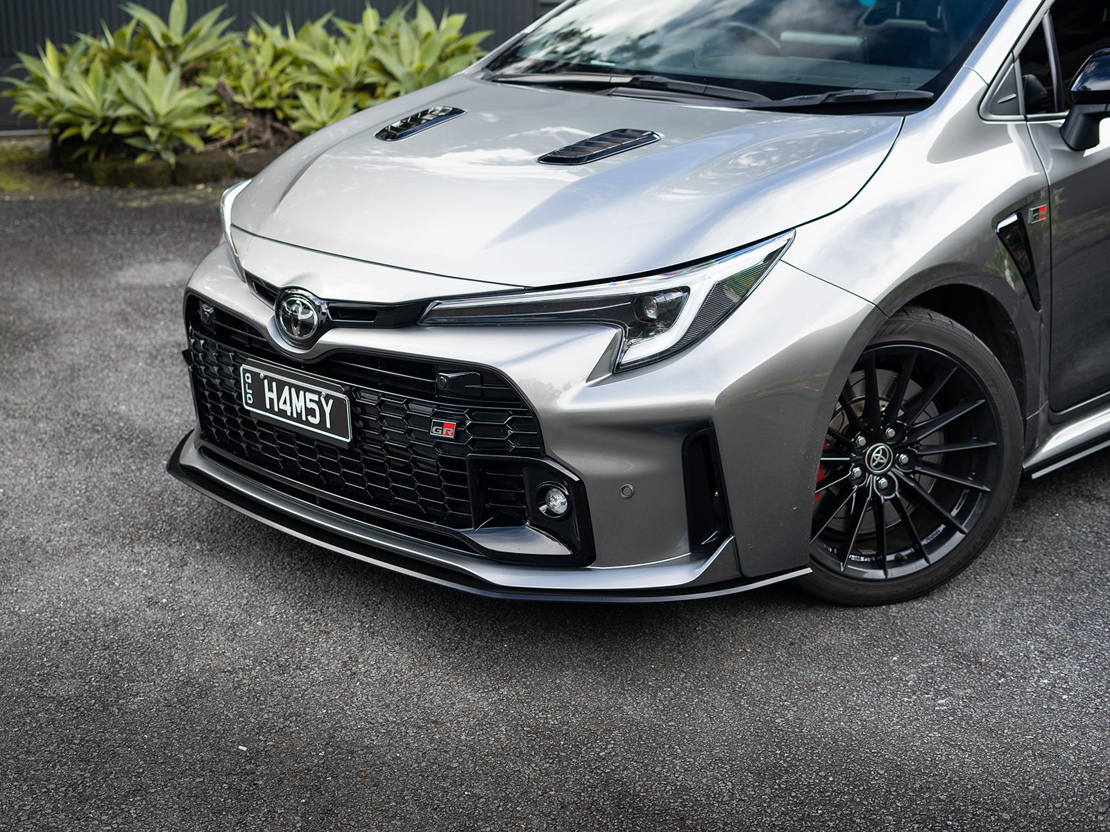Outdoor shot of GR Corolla front lip under natural light.
