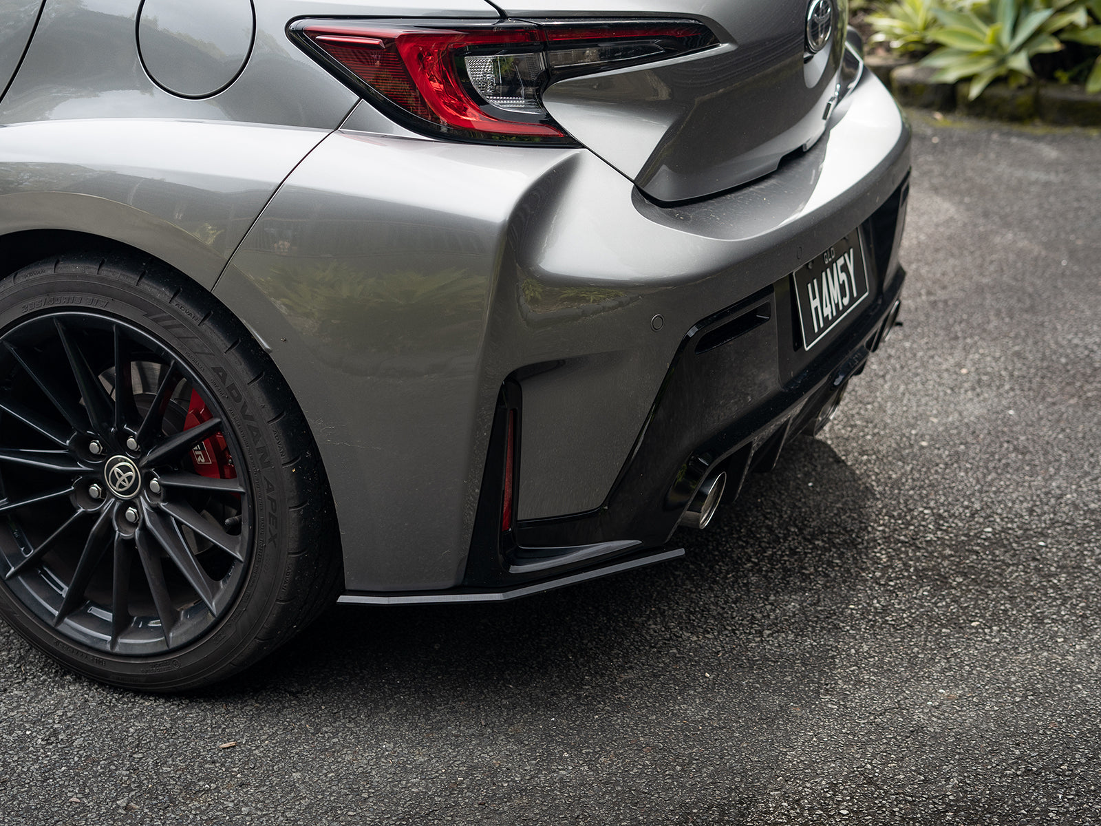 Ground-level shot of GR Corolla rear pods highlighting fitment and depth.
