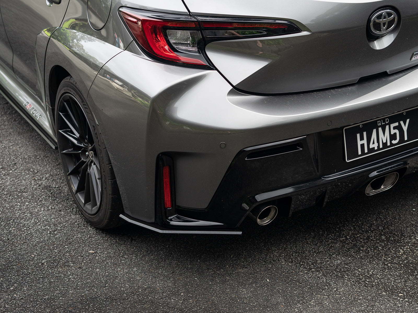 Split angle shot showing cohesive flow of the splitter kit from front to rear.
